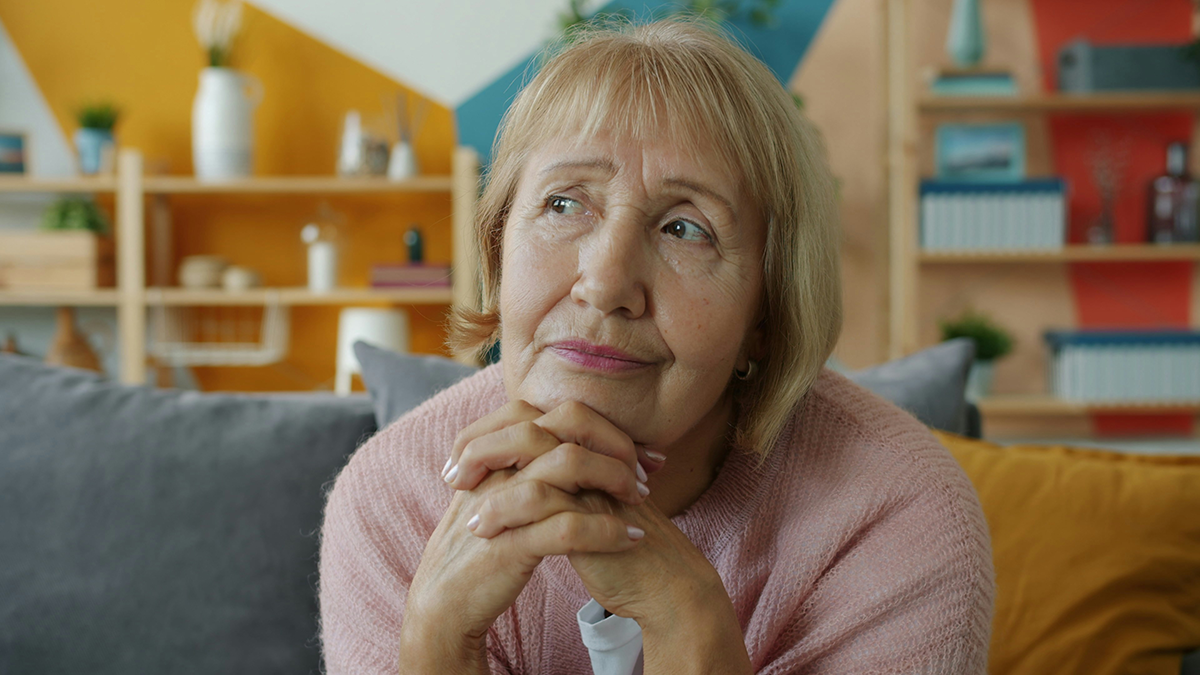 A senior reviewing Medicare options on a laptop